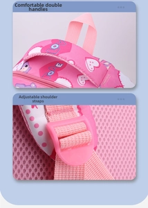 Pink school backpack detail showing reinforced padded handle and adjustable strap buckle