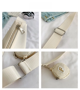 Vue détaillée du sac bandoulière en nylon crème avec zip argenté et petite pochette ronde