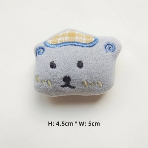 Detail of grey bear plush patch with embroidery showing size 4.5cm by 5cm for DIY