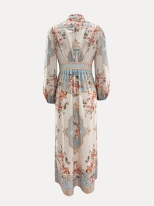 Rear view of vintage floral dress showing high waist cut and elegant lantern sleeves