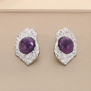 Detailed close-up of 18K gold plated irregular earrings with purple cat-eye stones