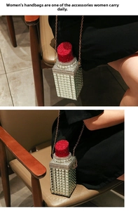 Detail view of lipstick shaped evening bag with sparkling rhinestones and chain strap