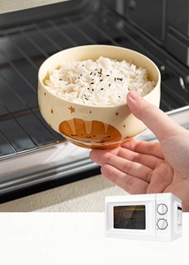 Cartoon ceramic bowl with bread patterns shown as microwave and oven safe dinnerware