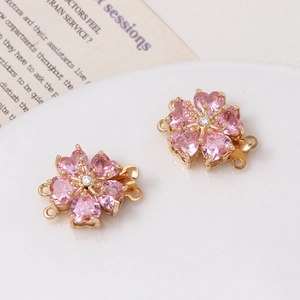 Close-up of pink flower jewelry clasp with gold base and zircon for pearl bracelets