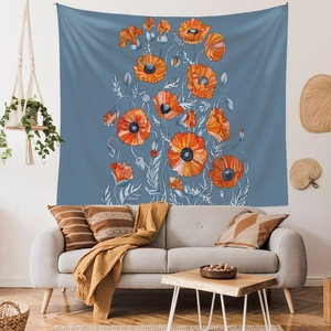 Detail of wall tapestry featuring orange poppy flowers on a vintage blue background