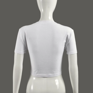 Back view of white cropped T-shirt with fringe tassels and star patchwork on grey background
