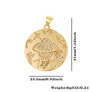 Detailed view of gold UFO pendant with zircon inlay and 31mm height measurement