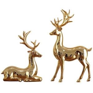 Golden plated elk statues in standing and sitting poses for modern home shelf decor