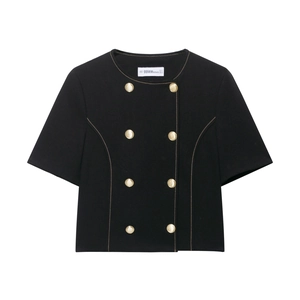 Women's black short sleeve double-breasted blazer with ornate gold buttons on white backdrop