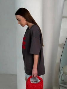 Oversized dark grey cotton t-shirt with red lettering and pleated red handbag detail