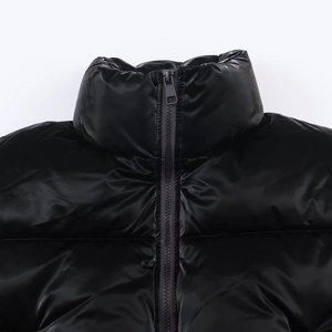 Glossy black windproof jacket with metallic zipper and high-shine nylon finish