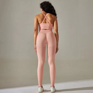 Pink yoga set detail showing breathable mesh hollow design on back of seamless leggings