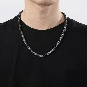 Detailed view of 6mm stainless steel Byzantine chain with silver and black retro finish