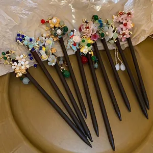 Classic Chinese style wooden hairpins with butterfly flower tassels and golden accents