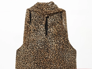 Detail of leopard print pattern on lightweight halter neck dress fabric