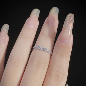 S925 sterling silver twist ring with zircon inlay for women shown on a model's finger
