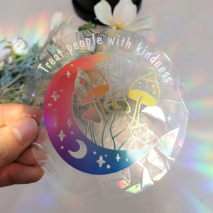 Rainbow prism suncatcher sticker with moon and mushroom design and treat people with kindness