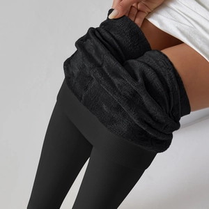 Detail showing the thick black fleece lining and high elasticity of thermal leggings