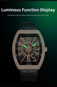 Luminous hands and date window detail on a luxury iced-out tonneau men's watch