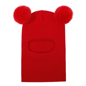 Close-up of bright red knitted balaclava with dual fluffy faux fur pom-poms for toddlers