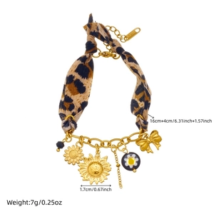Leopard print fabric and gold chain bracelet with sunflower and bowknot pendants