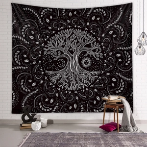 Detail of life tree tapestry on white brick wall with bohemian room decorations