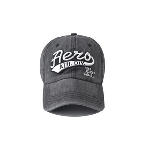 Close-up of vintage washed grey cotton baseball cap with detailed white embroidery art