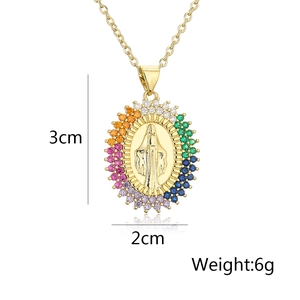 Detailed view of gold Virgin Mary pendant with colorful zircon stones measuring 3cm by 2cm