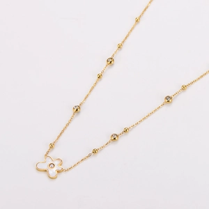 Golden flower necklace with white enamel petals and cubic zirconia accents for women
