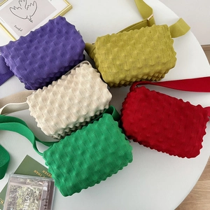 Colorful knit popcorn textured crossbody bags in purple, yellow, cream, green and red colors
