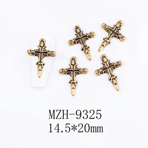 Detail of vintage gold skull cross nail art charm with 14.5x20mm dimensions