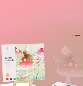 Detail showing forest animals watercolor paint book with built-in color palette for kids