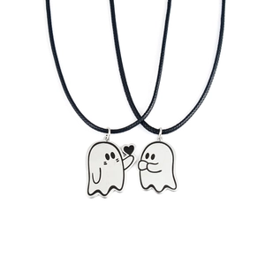 Detail view of cute cartoon ghost necklaces with black heart and woven wax cords