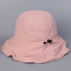 Detailed view of pink sun hat with adjustable drawstring and breathable fabric texture