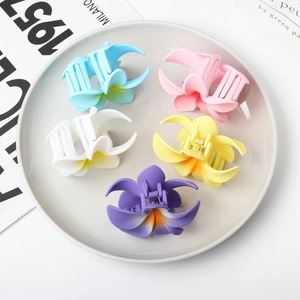 Set of five colorful flower hair claws in blue pink white yellow and purple colors