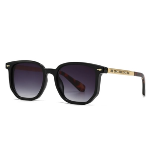 Modern pilot sunglasses with black square frames and gold hollow-out pattern temples