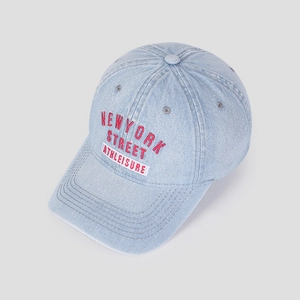 Detail of red New York embroidery on light blue washed denim baseball cap with stitching
