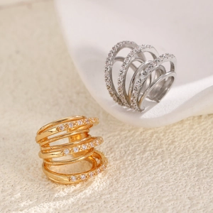 Multi-layer gold and silver cuff earrings with sparkling zircon stones in a sleek design