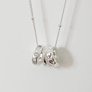 Elegant 925 sterling silver necklace featuring interlocking triple rings with zircon accents