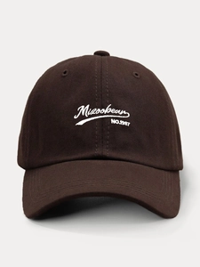 Detail of dark brown cotton baseball cap featuring white Mizookean embroidered script