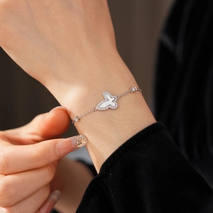 Detailed view of an elegant butterfly bracelet with mother of pearl and zircon stones