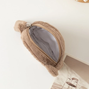 Detail of plush cat coin purse with soft faux fur brown ears and metal zipper closure