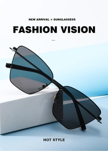 Detailed view of Y2K cat-eye metal sunglasses with dark lenses on a geometric stone base