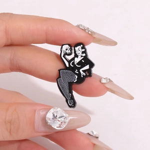 Gothic cartoon enamel pin featuring a vintage girl holding a skull on pink background