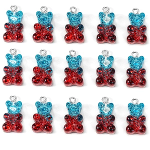 Macro view of 15 blue-red gradient resin glitter bear charms for DIY jewelry making