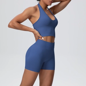 Close-up of indigo blue seamless knit yoga set showing ribbed texture and body fit