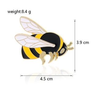 Detail view of enamel bee brooch with measurements 4.5cm width and 8.4g weight
