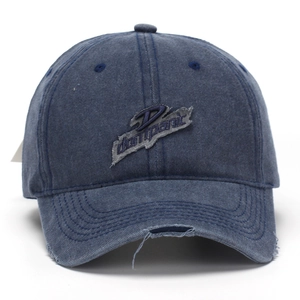 Vintage washed navy denim baseball cap with embroidered patches and distressed brim details