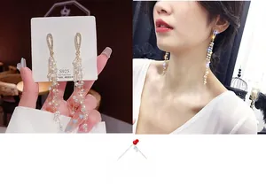Detailed view of S925 silver needle drop earrings with elegant pearl tassels