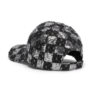 Detail of adjustable back strap and silver sequin checkerboard pattern on baseball cap